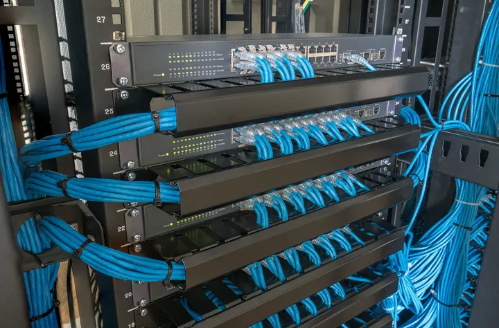AirGen engineer working on a communications cabinet